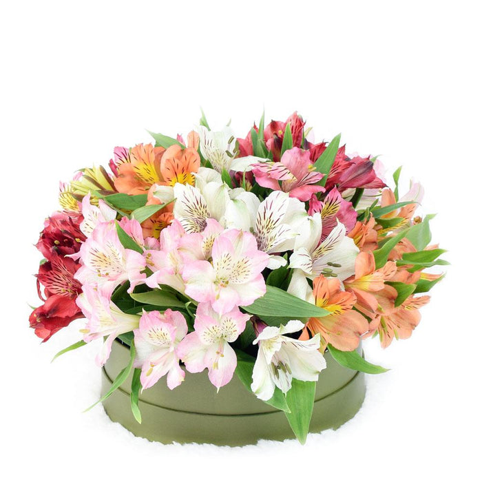 Elegant Lilies Hat Box Floral Arrangement – gift basket with this arrangement includes a variety of lilies in