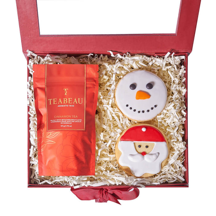 Festive Hinged Gift Box Featuring Cinnamon Tea and Holiday Cookies – gift basket with snowman face sugar cookie, santa face sugar cookie and teabeau