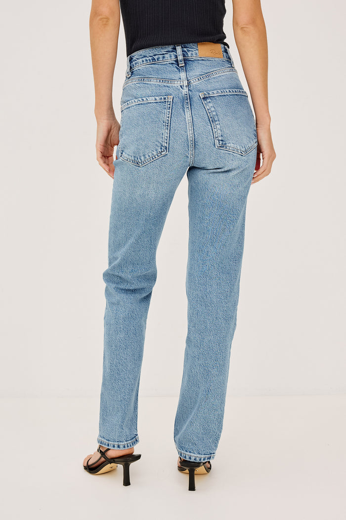 Topanga Petite High-Rise Wide Straight Leg Jean in With 5-Pockets and a Front Zip-Fly in Old Indigo Colorway - Front View Featured on Model