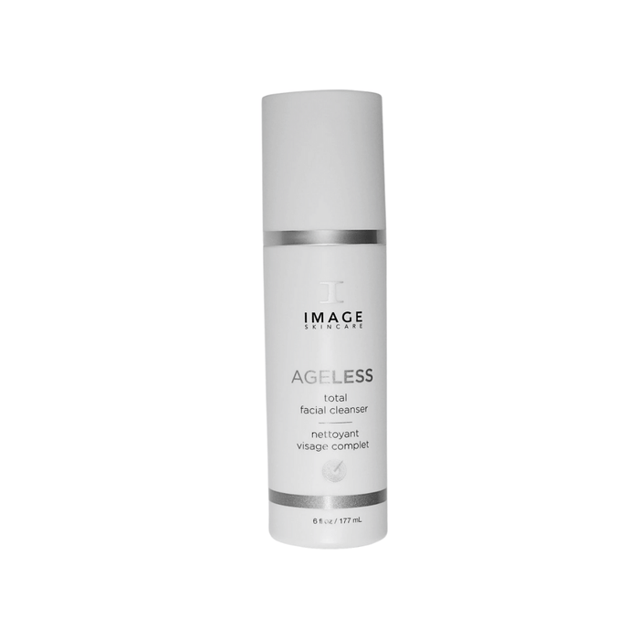 Bottle of AGELESS total facial cleanser | IMAGE Skincare with minimalist white design and silver accents, highlighting skincare and facial cleansing features.