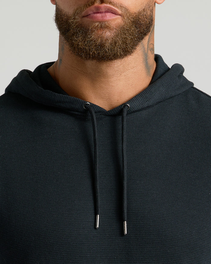 Bearded man in All Black Classic Waffle Hoodie.