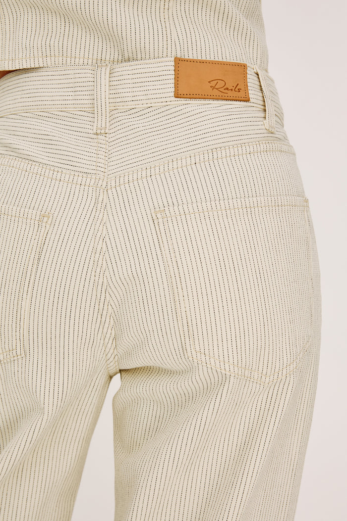 Belmont Arc Leg Jean in Rigid Denim With High-Waisted Fit, Button Fly, and 32" Inseam in Ecru Railroad Stripe Colorway - Lower Body Back View Featured on Model