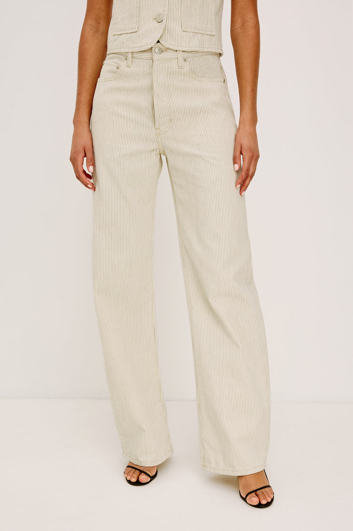 Belmont Arc Leg Jean in Rigid Denim With High-Waisted Fit, Button Fly, and 32" Inseam in Ecru Railroad Stripe Colorway - Lower Body Front View Featured on Model