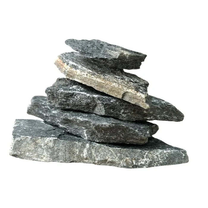 Balanced pyramid of dark gray rough-textured black slate stones