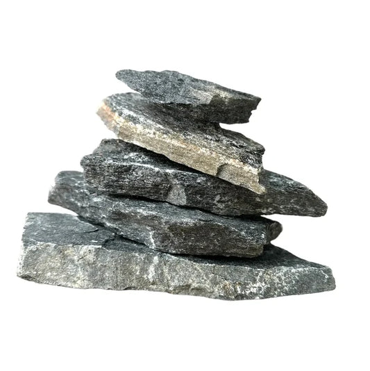 Balanced pyramid of dark gray rough-textured black slate stones