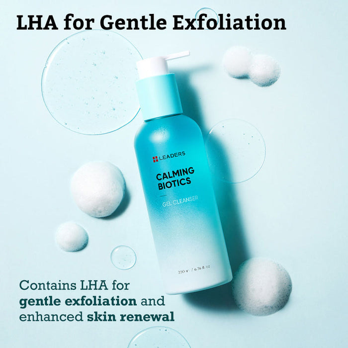 Bottle of Calming Biotics Gel Cleanser | Leaders in a blue gradient pump container surrounded by clear gel drops and soft white cotton balls on a light blue background, highlighting gentle exfoliation and skin renewal benefits.