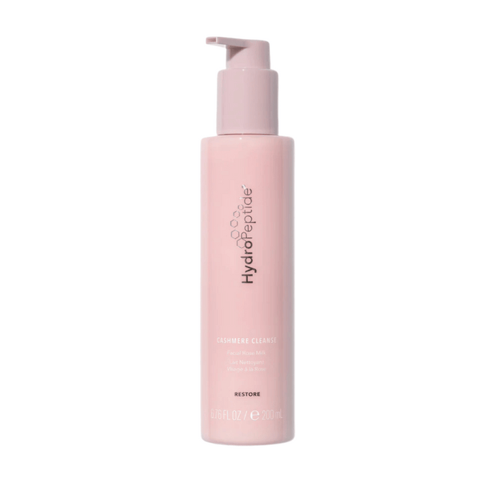 Bottle of Cashmere Cleanse | HydroPeptide facial rose milk cleanser in a soft pink pump container, designed for gentle skincare and facial cleansing.
