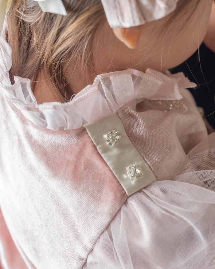 Close-up of Clara Pink Velour Jacket highlighting sheer puff tulle sleeves, ivory cuff detail, and rhinestone embellishments.