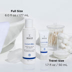 CLEAR CELL salicylic gel cleanser | IMAGE Skincare full size and travel size bottles displayed with cotton swabs, cotton balls, and a white towel in a clean skincare setting