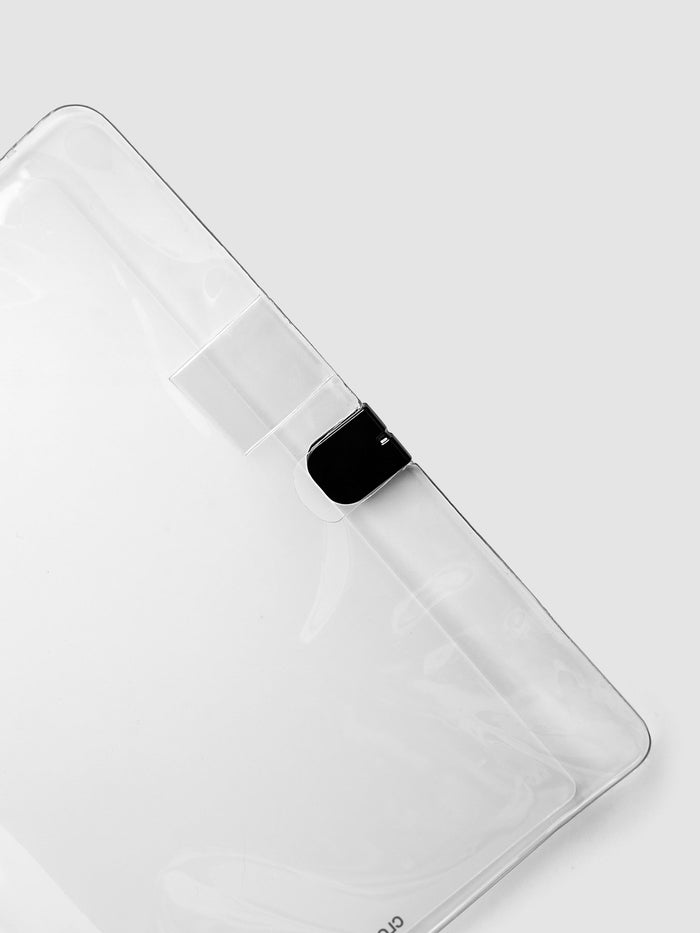Close up of the black closure hardware and clear pen loop on the Clear Vinyl Planner Cover in size CP Petite.