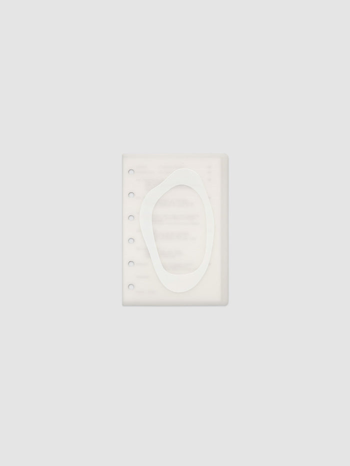 Continuation Planner Cover + Dashboard Set in Pocket. Milky white frosted plastic cover with a spot gloss organic shape over a black-printed paper dashboard. Image 1 of 3.