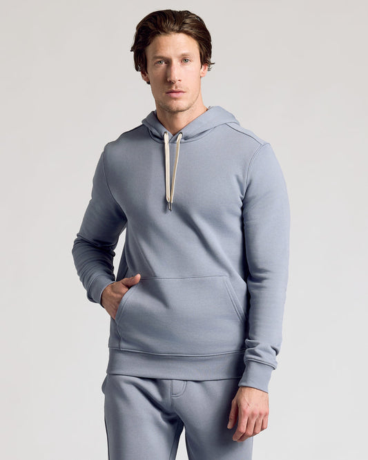 Man wearing Dusty Blue Fleece French Terry Pullover Hoodie with kangaroo pocket.