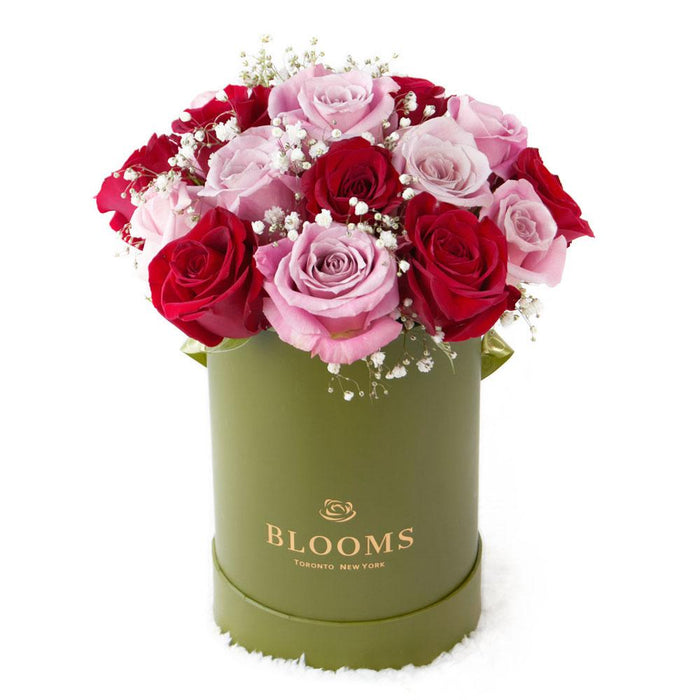 Elegant Pink and Red Roses Arrangement in Green Hat Box – gift basket with this arrangement includes a selection of pink and