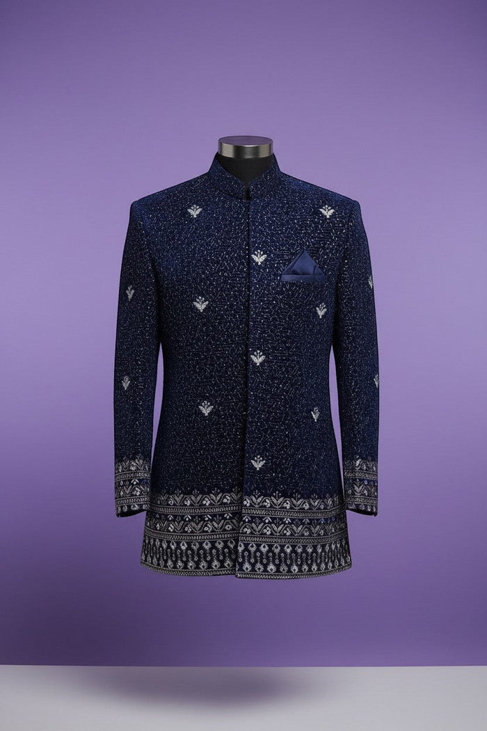 Kurti Connection USA navy blue Bandhgala jacket with silver embroidery and patterned border on cuffs and hem.