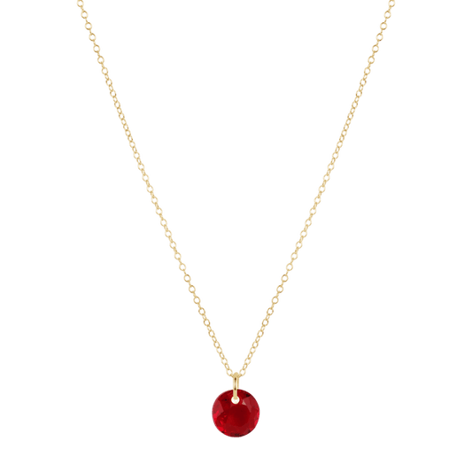 Gold necklace with a red pendant on a white background
