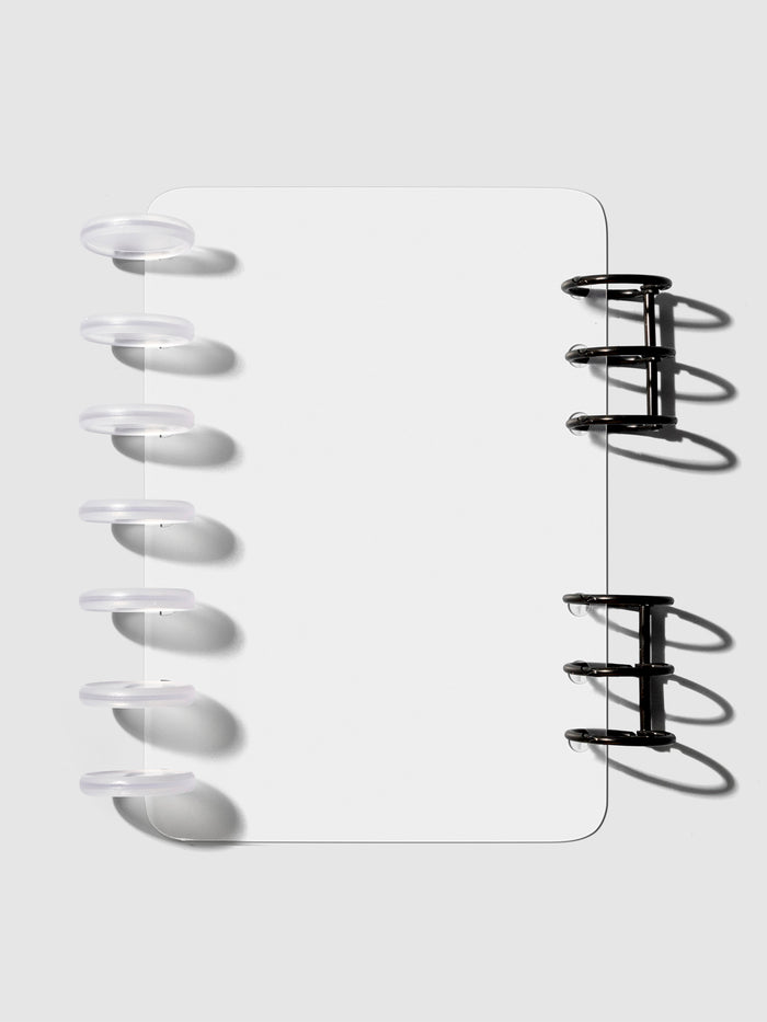 HP Mini / Personal cover displayed on a neutral background. It is shown filled with a set of clear planner discs and black planner rings.