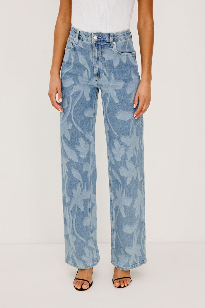 Getty Wide Leg Jean in Light Stretch Denim With High-Rise High-Waisted Fit, Button Fly, and 5-Pocket Styling in Floral Laser Colorway - Lower Body Front View Featured on Model