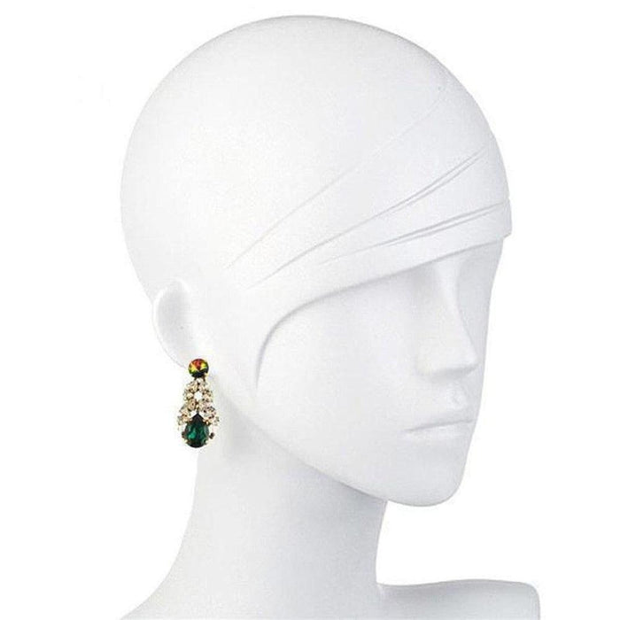 Elegant teardrop earrings featuring a dazzling green crystal and clear stones.
