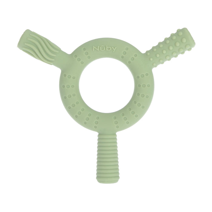 The Nuby Hollow Sensory Tube Teethers in green/blue is a circular baby teething toy with three textured handles, massaging bristles, and raised patterns. The Nuby brand name is embossed at the top of the ring.