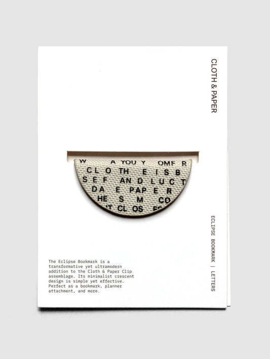 Magnetic Bookmark | Bookcloth | Letters shown in packaging on a neutral background.