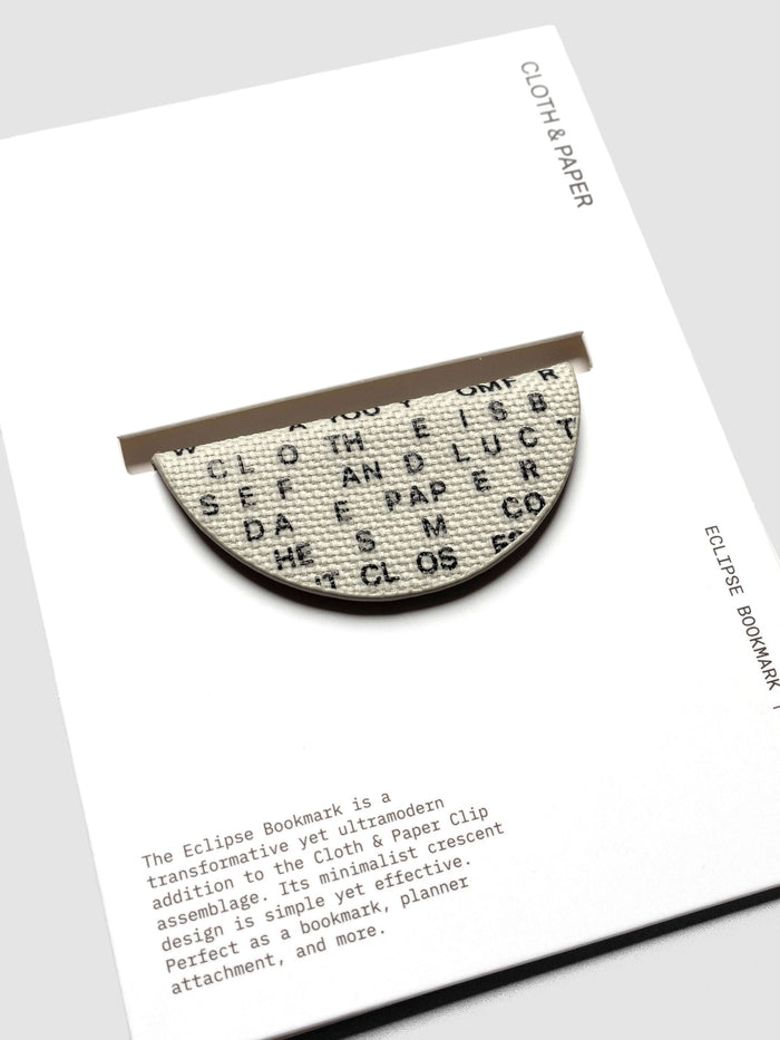 Magnetic Bookmark | Bookcloth | Letters shown in packaging, close up, on a neutral background.