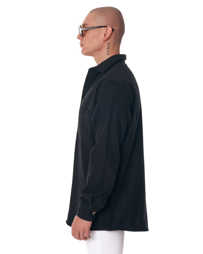 Martin Valen black men's lumberjack shirt, left side profile view showing collar and buttoned sleeve cuff