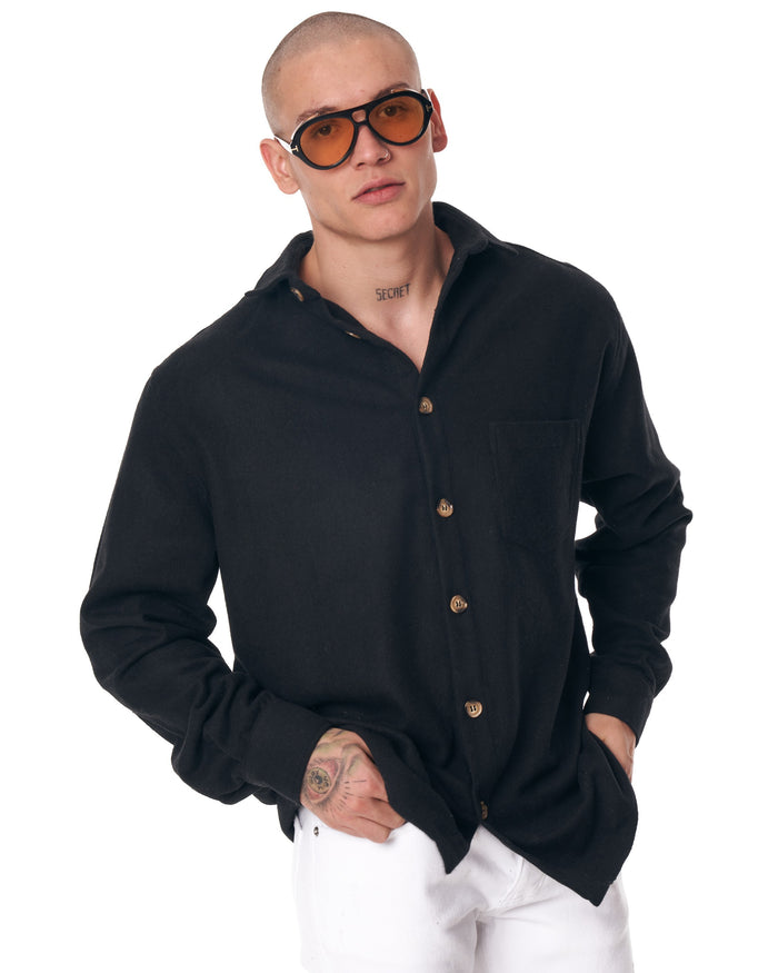 Martin Valen black men's lumberjack shirt, full back view to hips with buttoned cuffs visible