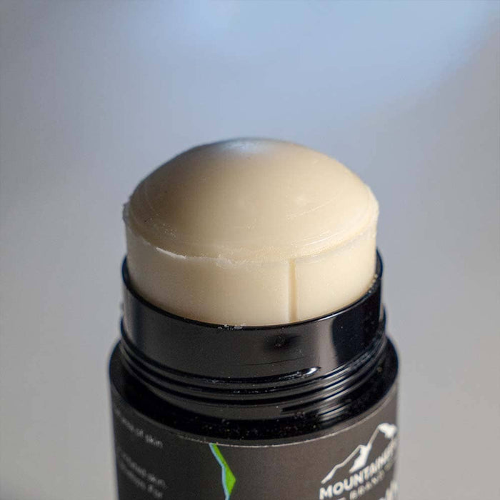 A close up of an all-natural jar of Mountaineer Brand Products beeswax lip balm.