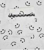 White pajama shorts with smiley print, elastic waist, black lace trim panel