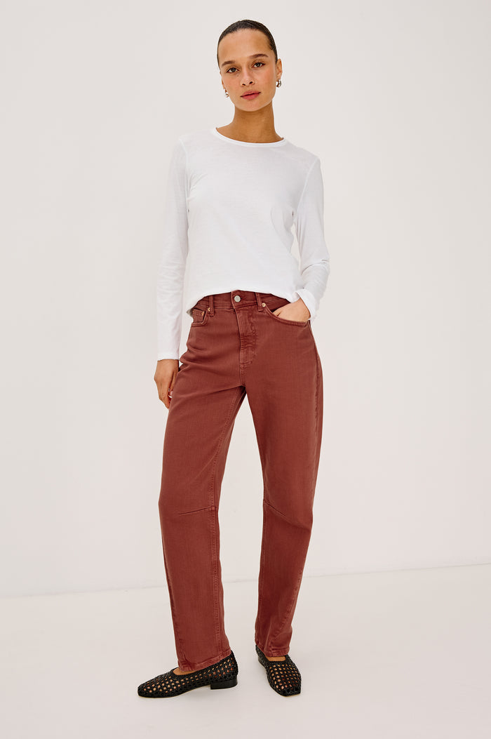 Samo Barrel Leg Jean in Light Stretch Denim With 5-Pockets, Low-Slung Fit, Darted Details, and Front Zip-Fly in Vintage Brick Colorway - Full Body Front View Featured on Model