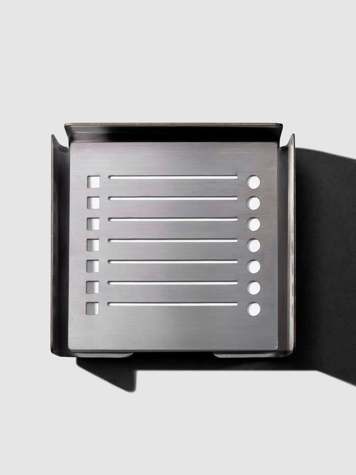 Sticky Note Holder With Stencil, Cloth and Paper. Sticky note holder displayed on a neutral background with stencil placed inside.