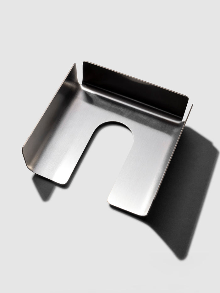 Sticky note holder displayed on a neutral background.
