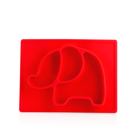 The Nuby Sure Grip Miracle Mat All-in-One Feeding Placemat is a red silicone elephant-shaped plate with divided compartments for head, ear, and body. This suction baby plate stays in place and is displayed on a white background.