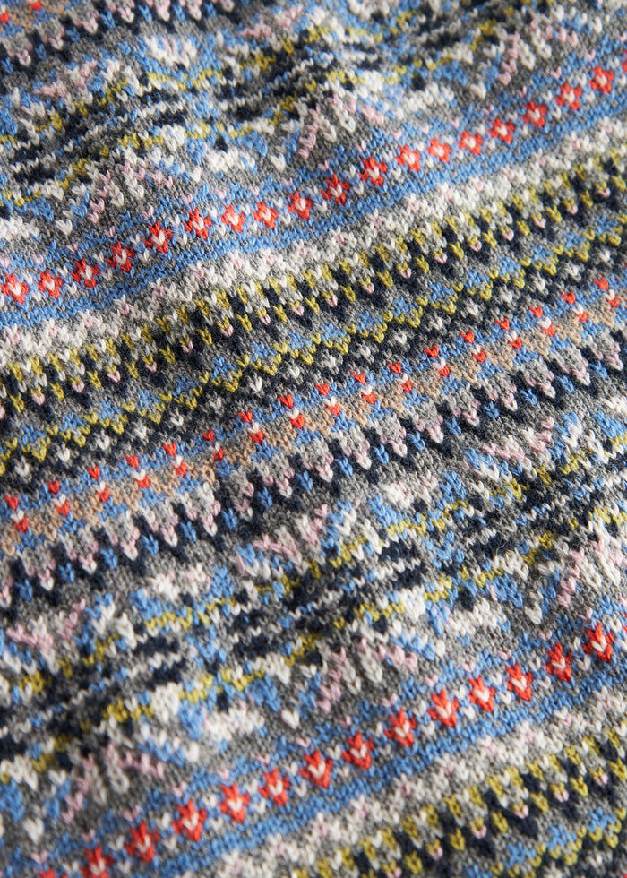 Knitted children's vest with colorful pattern and V-neck
