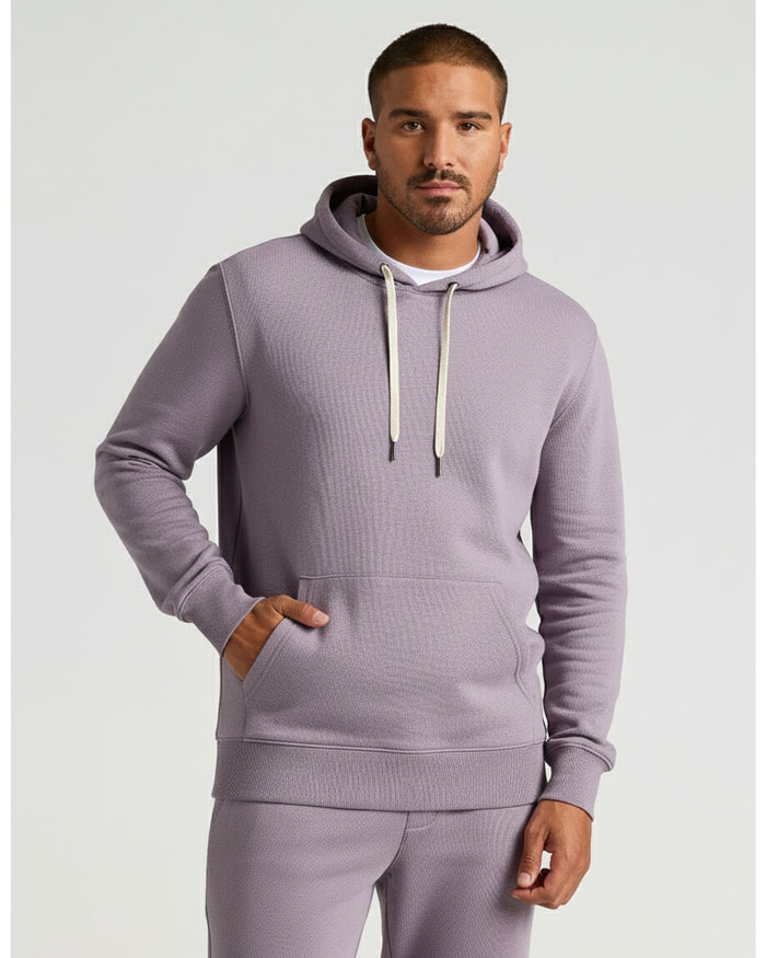 Model in Thistle Fleece French Terry Pullover Hoodie, showcasing relaxed fit.