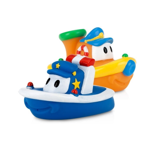 The Nuby Tub Tugs (2 Pack) features colorful baby bath boats—one blue with stripes, one orange with a green funnel—each with cute cartoon faces and sailor hats, making perfect floating toys for fun-filled bath time.