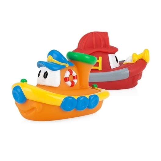 Nuby Tub Tugs (2 Pack) features two colorful baby bath boats—one orange/yellow with a blue captain’s hat, the other red with a fireman’s hat and yellow nozzle—perfect floating toys for fun bath time adventures.