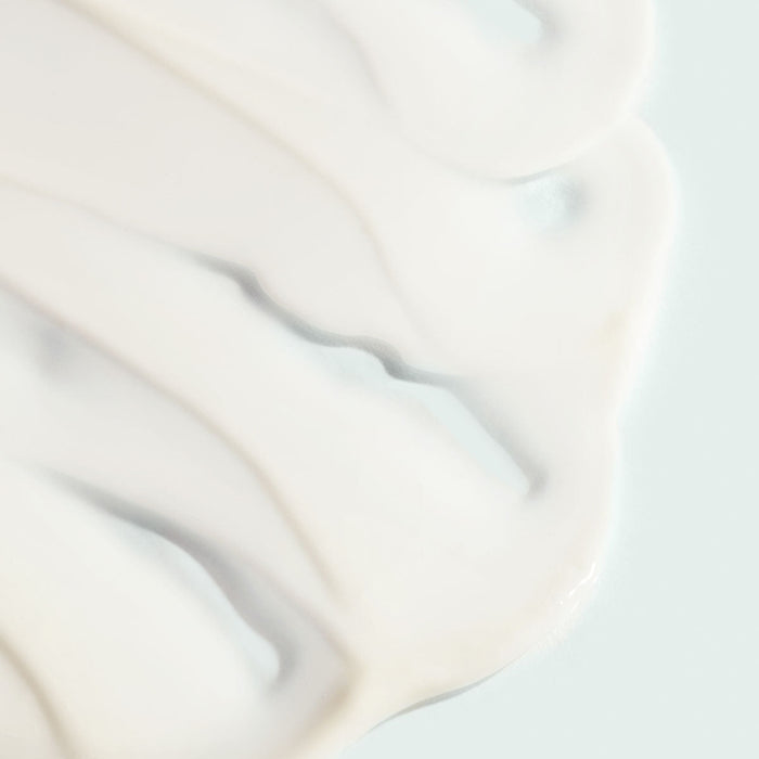 Close-up texture of smooth, creamy skincare product representing VITAL C hydrating anti-aging serum | IMAGE Skincare for hydration and skin wellness.